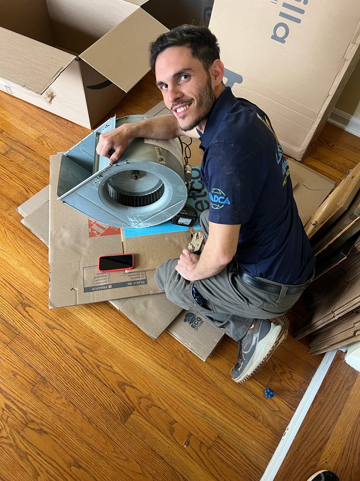 LServices technician cleaning an air duct on the job